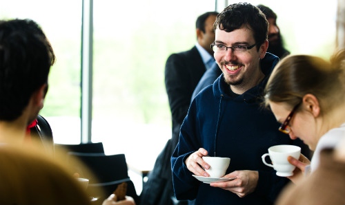 people chatting at event