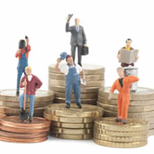 image of people standing on piles of large coins