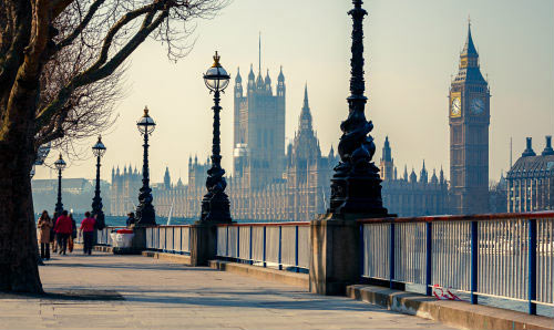Pavement by the Thames with Houses of Parliament in the background